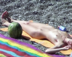 Voyeur films a nudist family with a hidden camera as they have fun at the beach