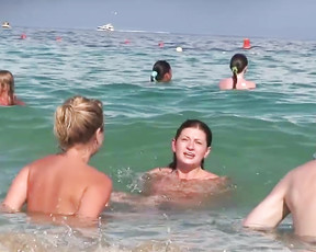 Young and playful nudist babe has fun with her family