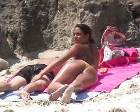 Nude chick at a naked beach swims with her boyfriend